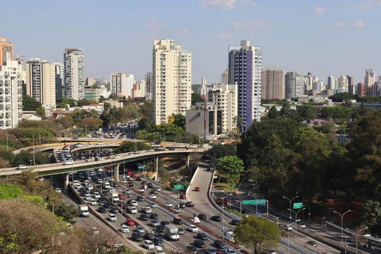 the skyline with traffic on a busy day in front of tall buildings