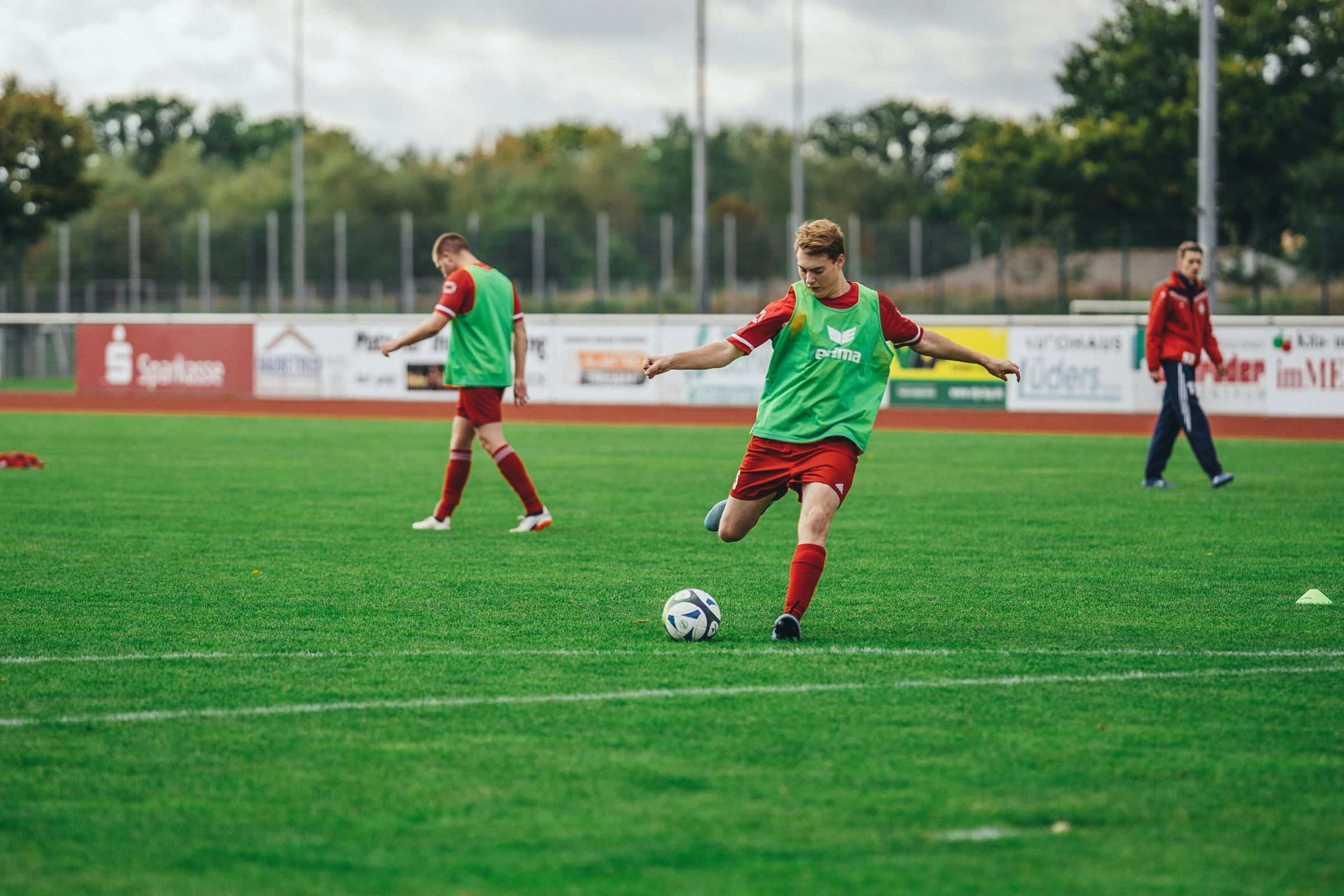 two teams playing soccer on the field