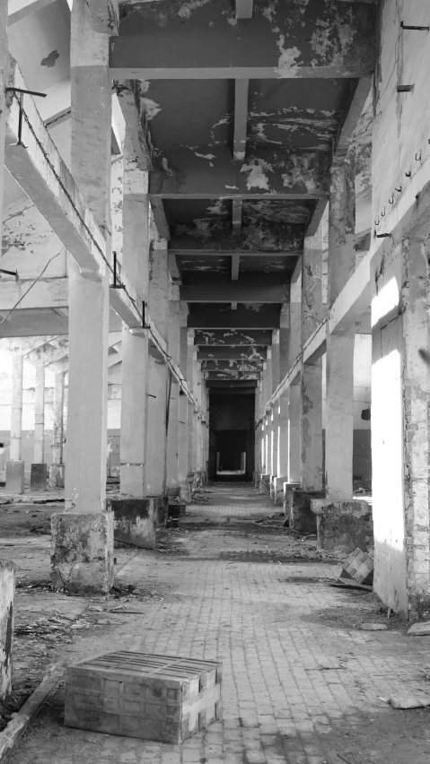 a large walkway between two buildings with brick walls