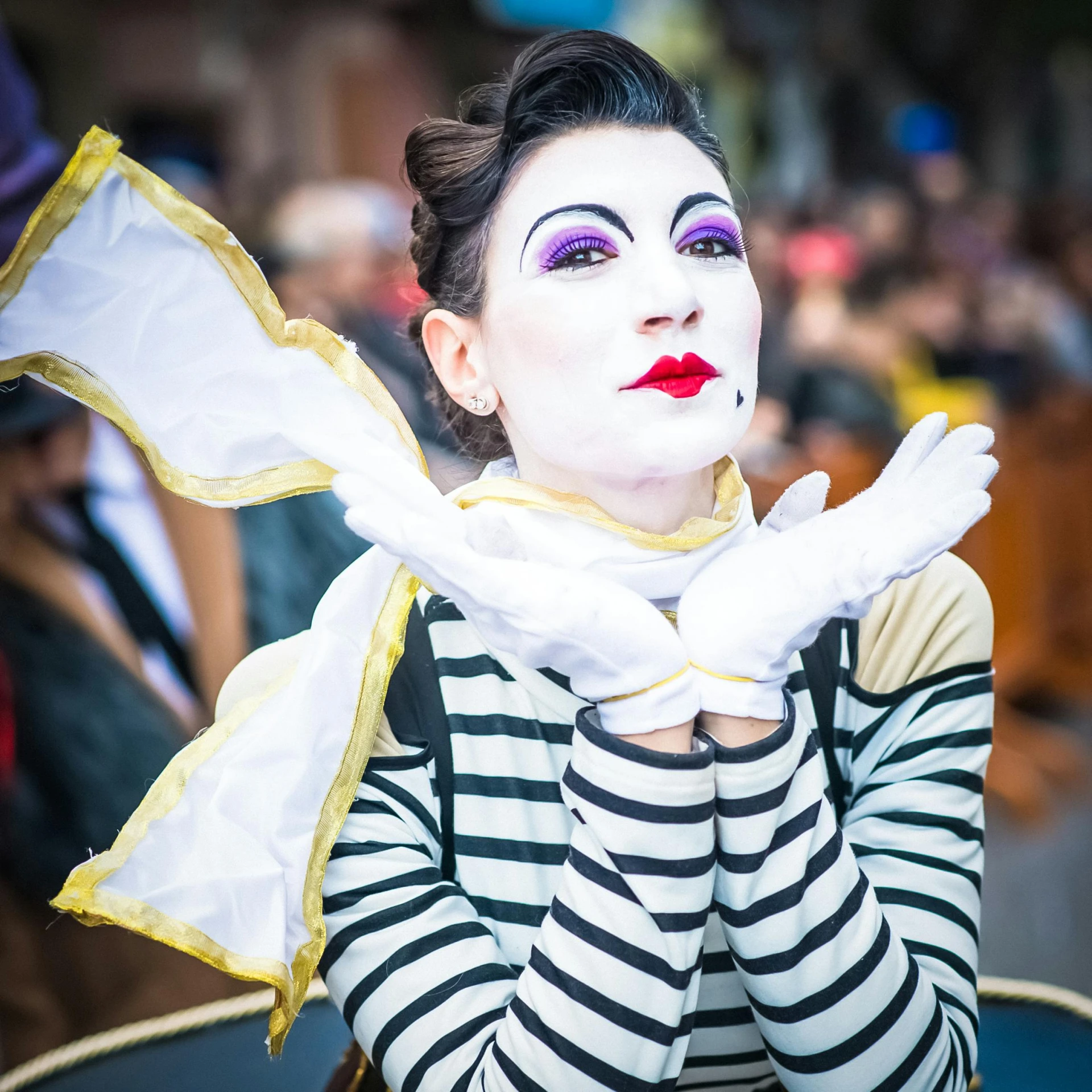 a woman with clown makeup and black and white costume