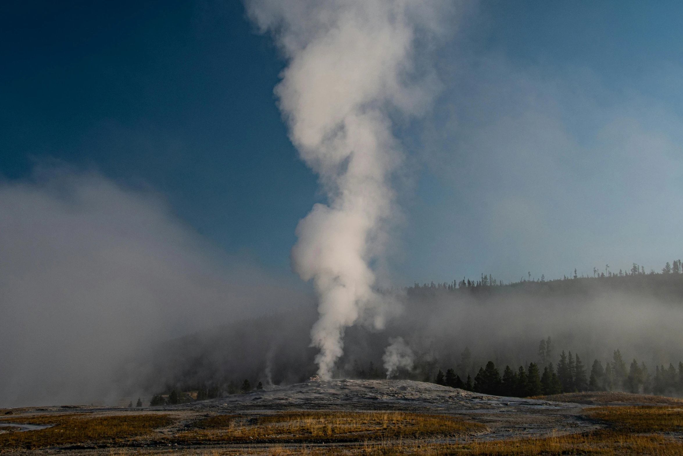 there is a large structure of steam rising from the ground