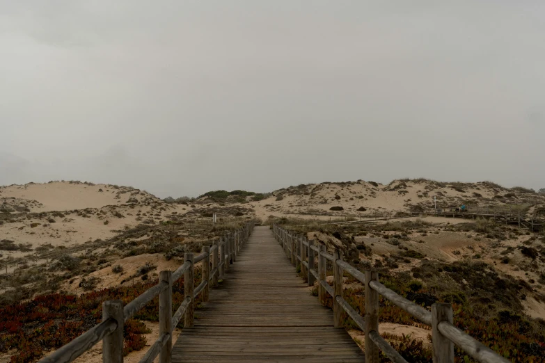 the boardwalk leads to the beach and sand dunes