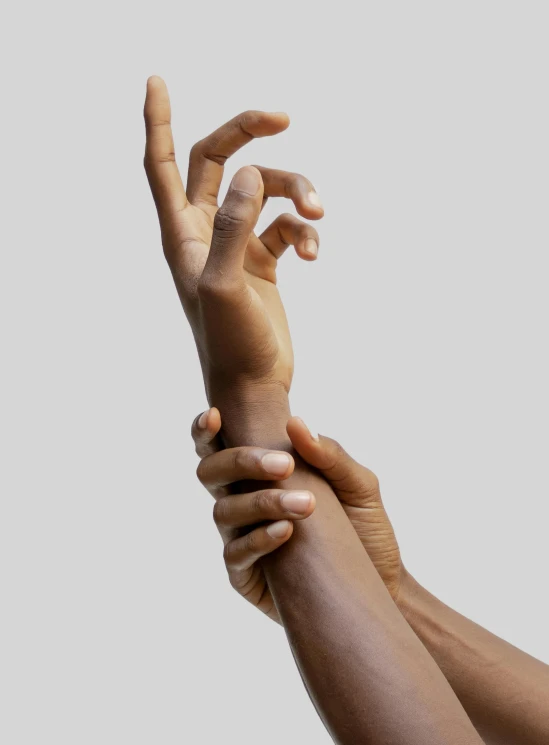 two hands reaching into one another's palm