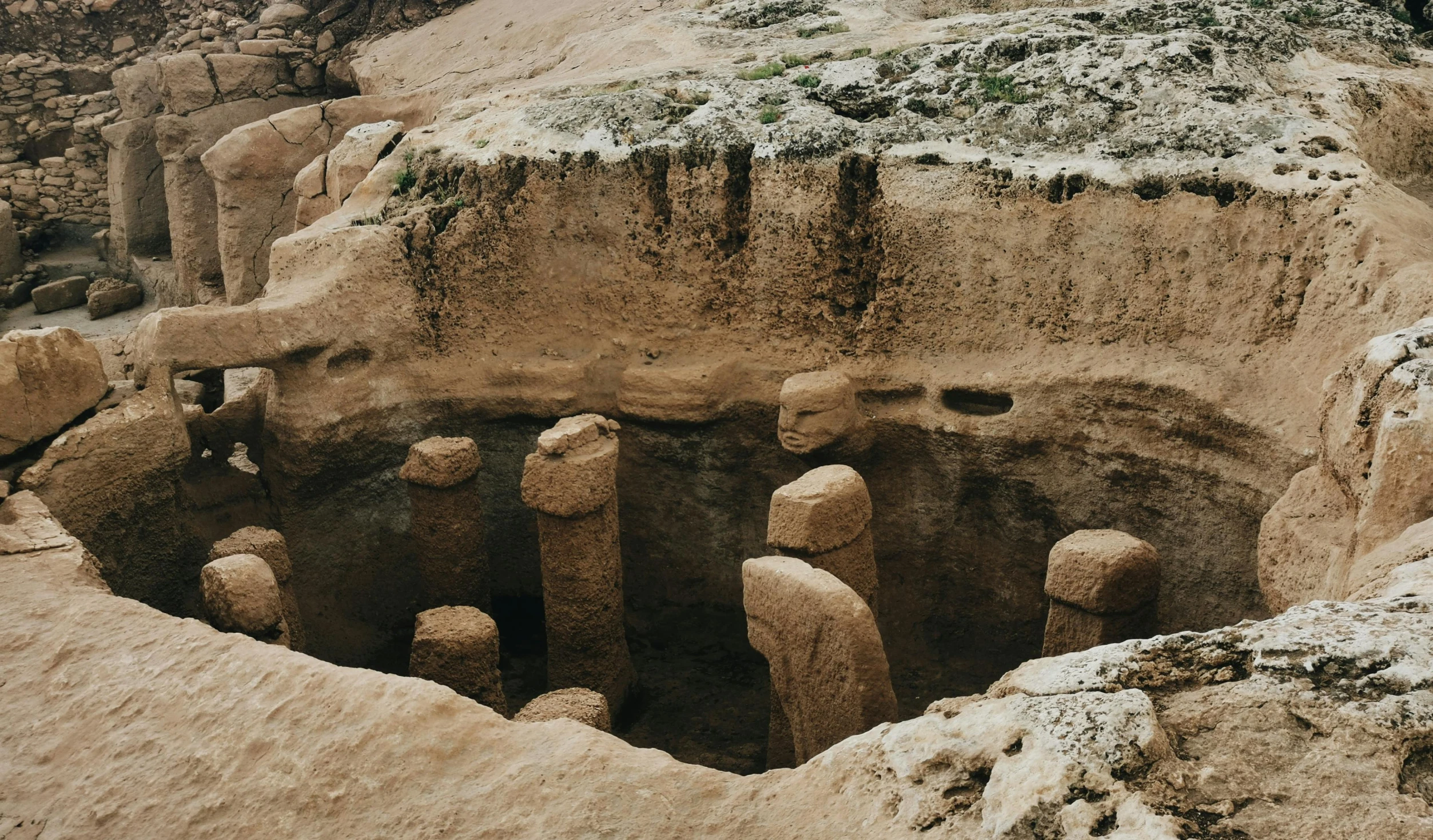 a cave is in the ground of an ancient mountain