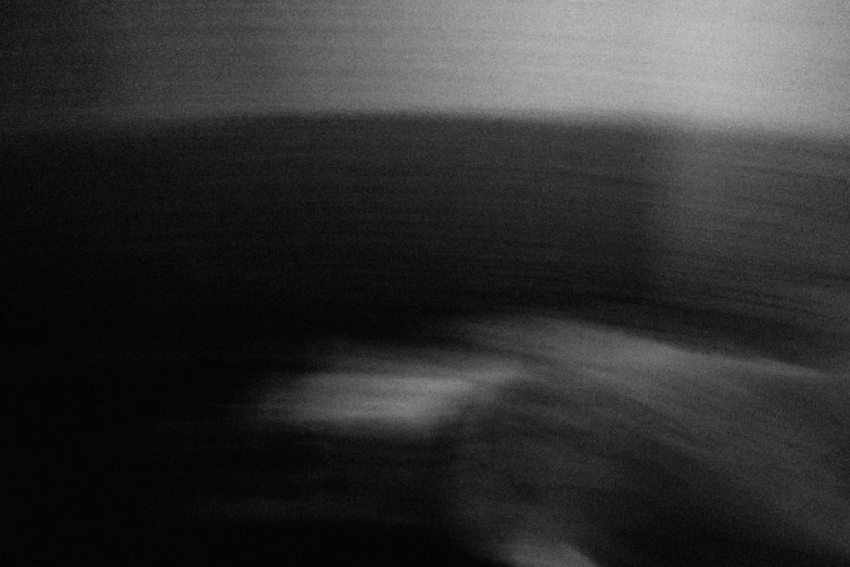 a blurry po of some furniture in a dark room