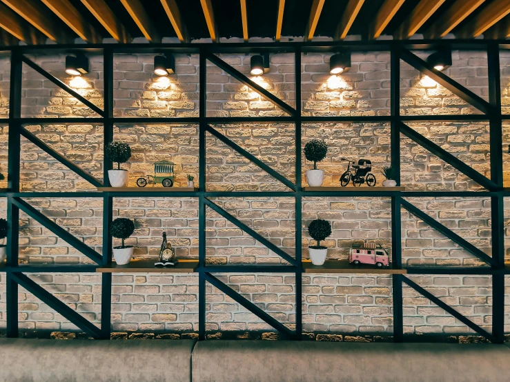 an industrial styled wall with shelves and lighting