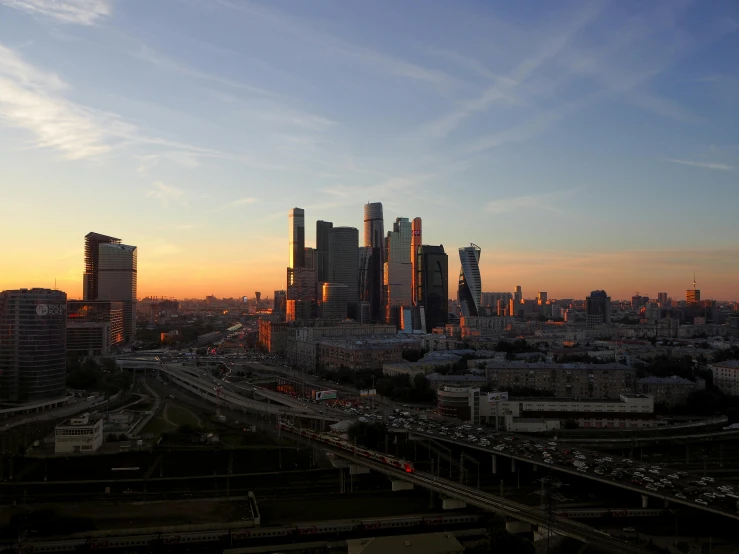 a sunset view of a large city in the day time