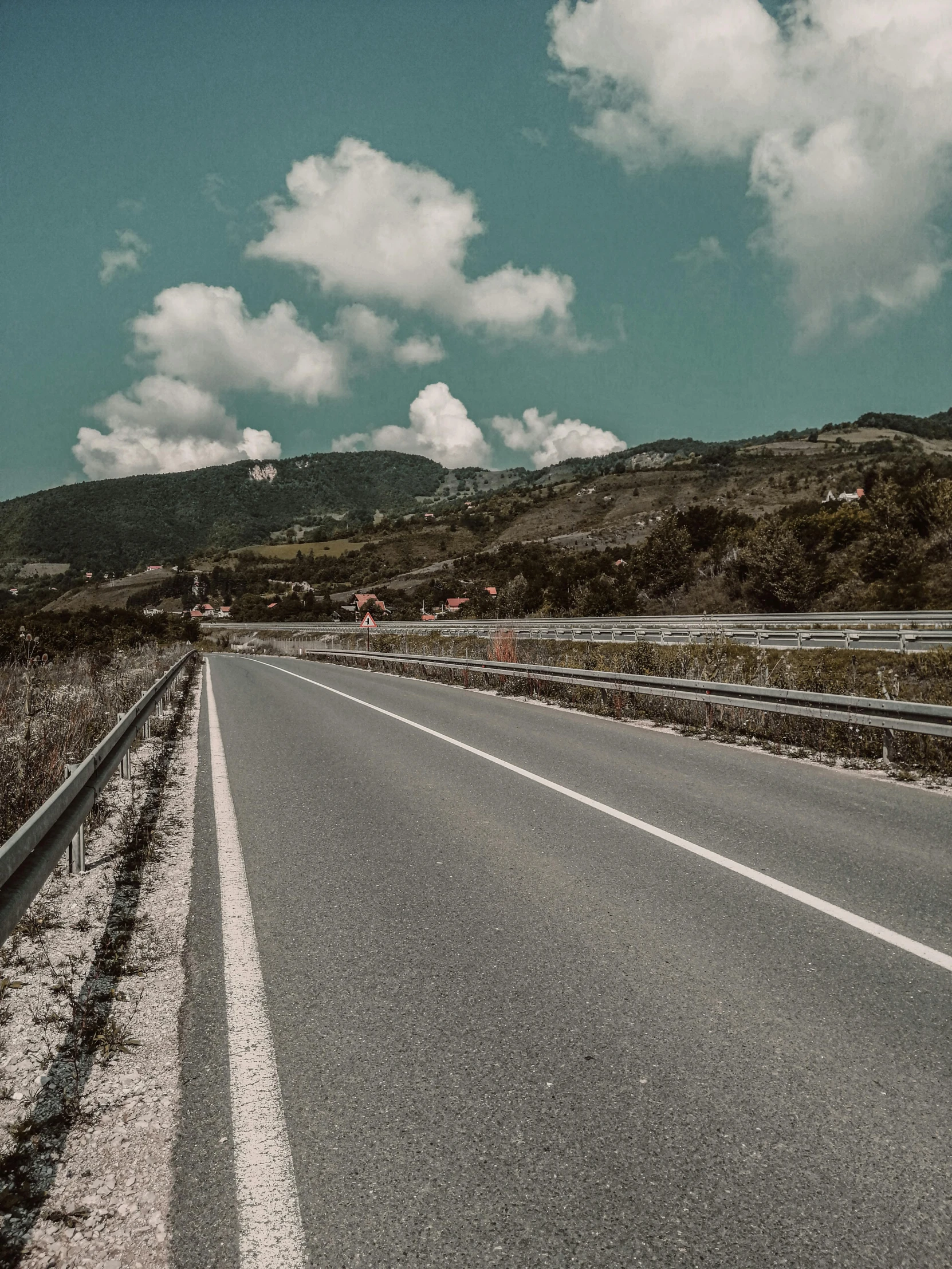 a motorcyclist rides down the open road