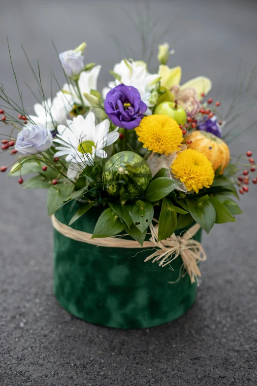 a close up of flowers in a green vase