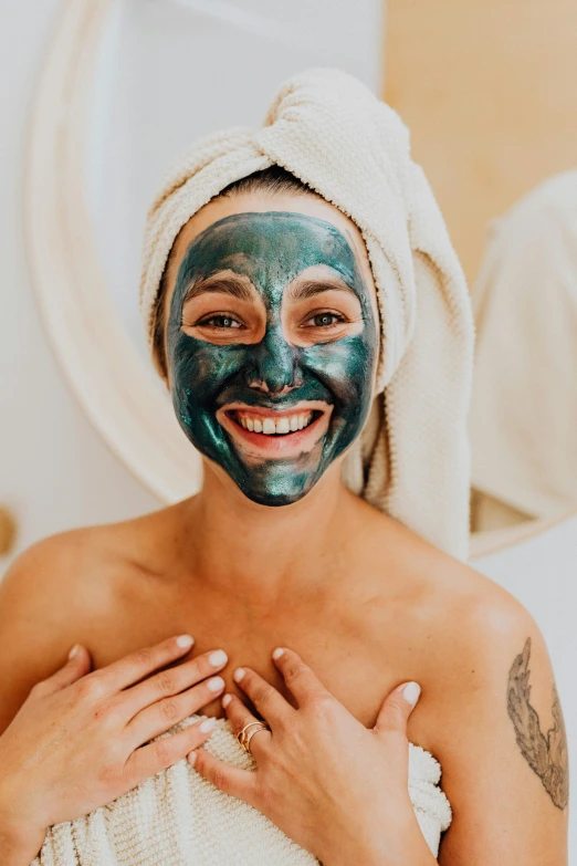 a woman is in a spa with a facial mask on