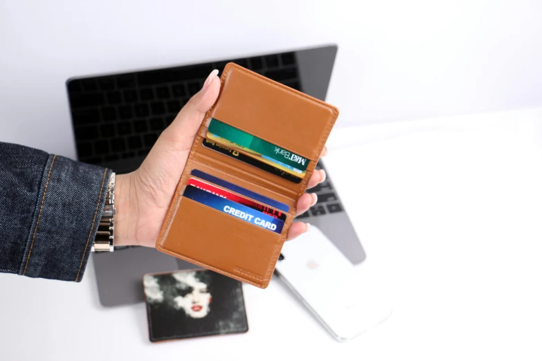 this is a wallet and it is made with leather