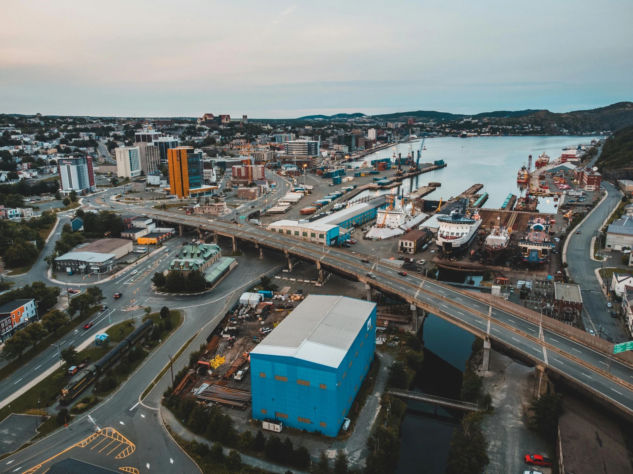 a river view looking down onto the city and docks