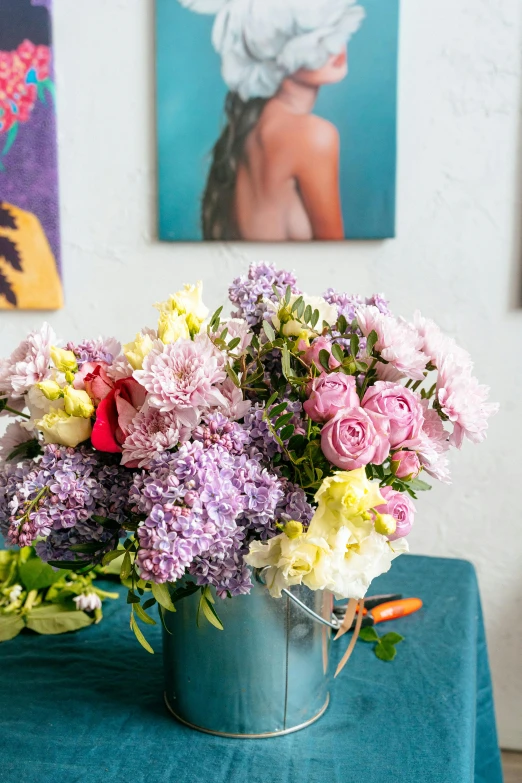 colorful bouquet of flowers in an iron pail