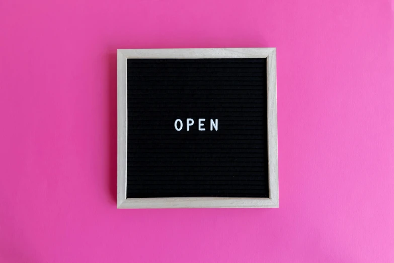 the words open are placed on a square in the center of a pink square