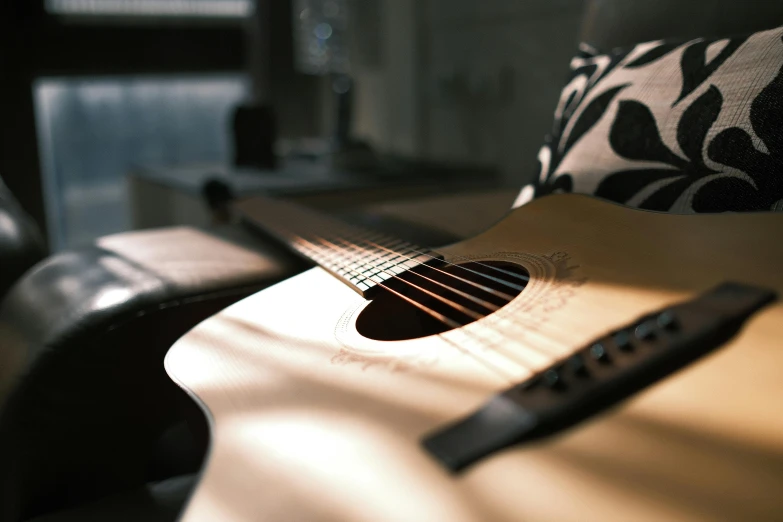 a close up of an acoustic guitar