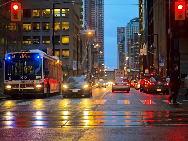 several traffic lights are shining on the street