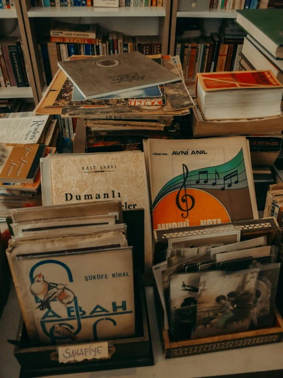 a table topped with books and a musical record