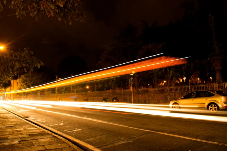 a car is passing by a gas station at night