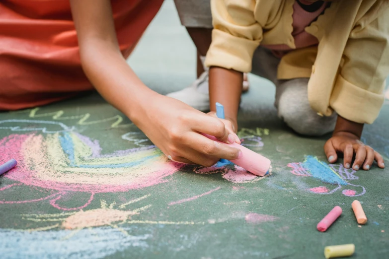 a person doing soing on the ground with chalk