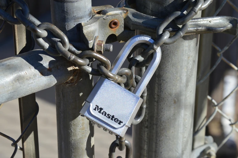 a silver padlock with the word masters attached to it