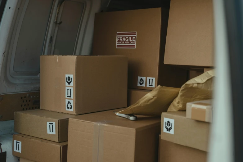 boxes stacked up in the back of a van