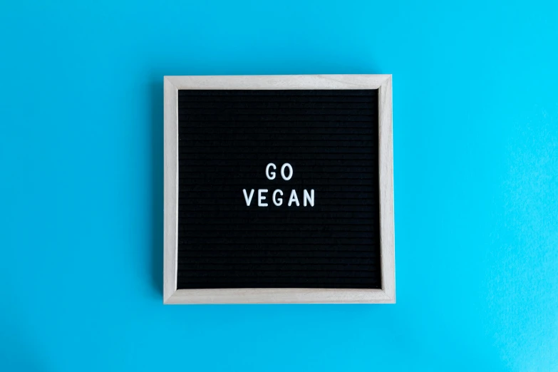 a go vegan sign with the word go vegan written on it