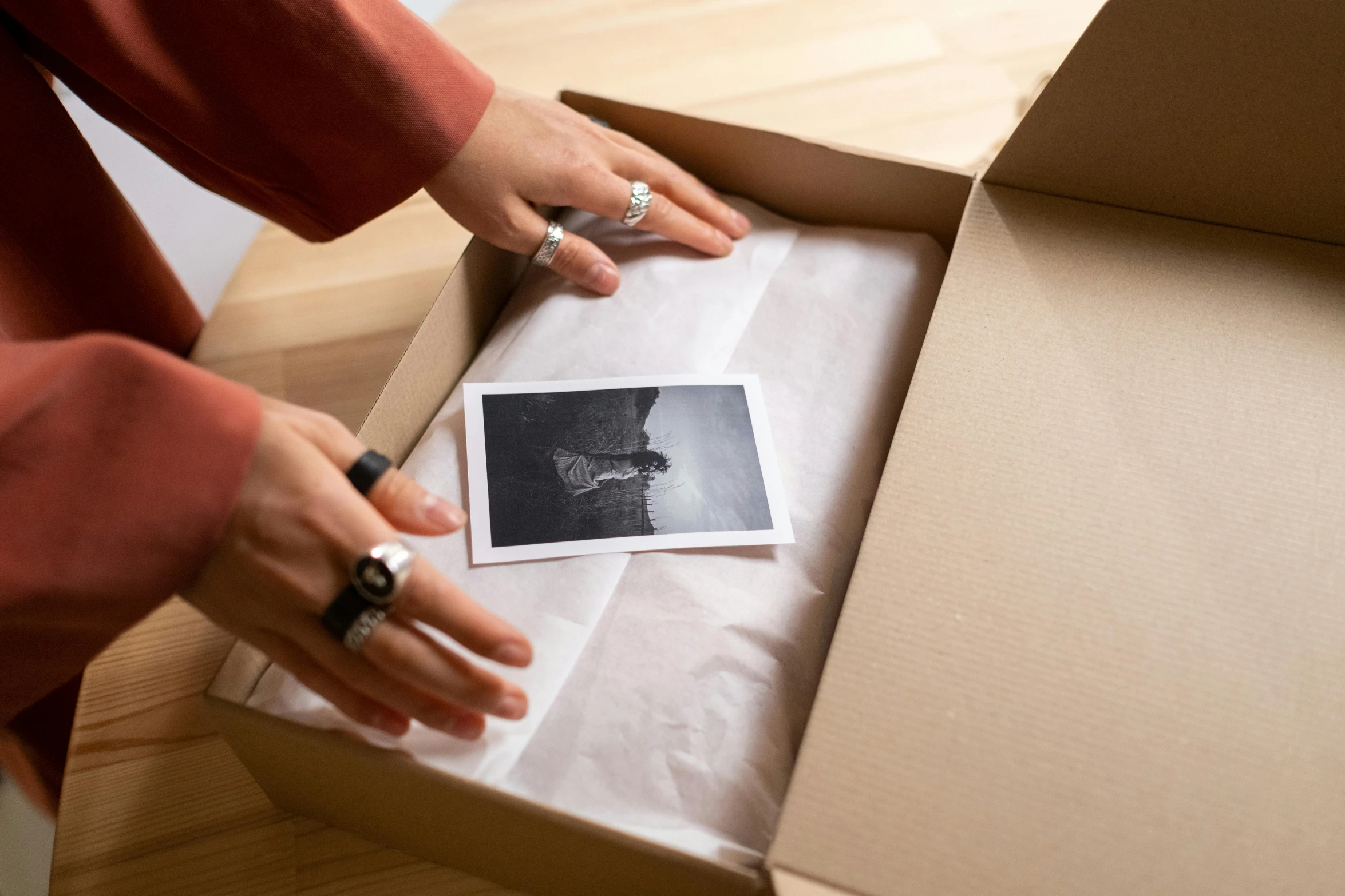 someone holding a card that is in a box