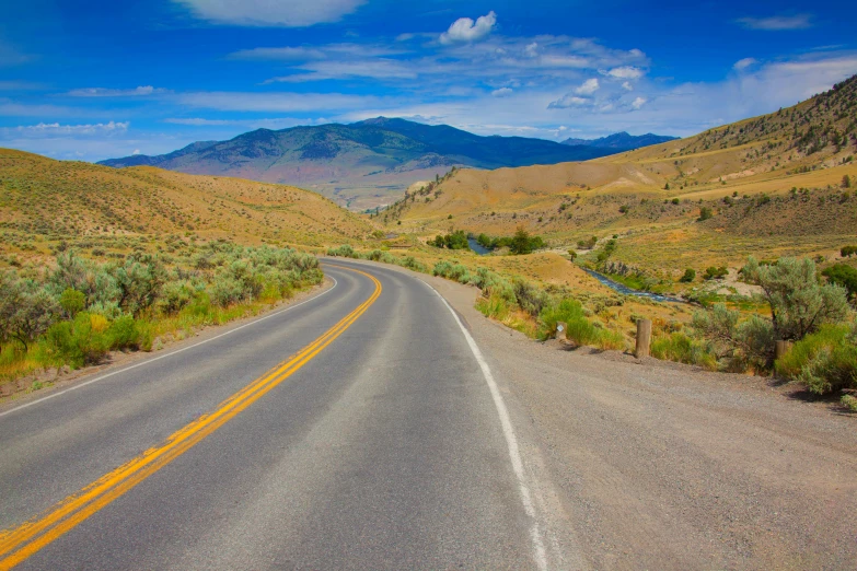 a curve in a road going through a mountainous region