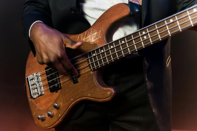 a person holding onto a bass bass