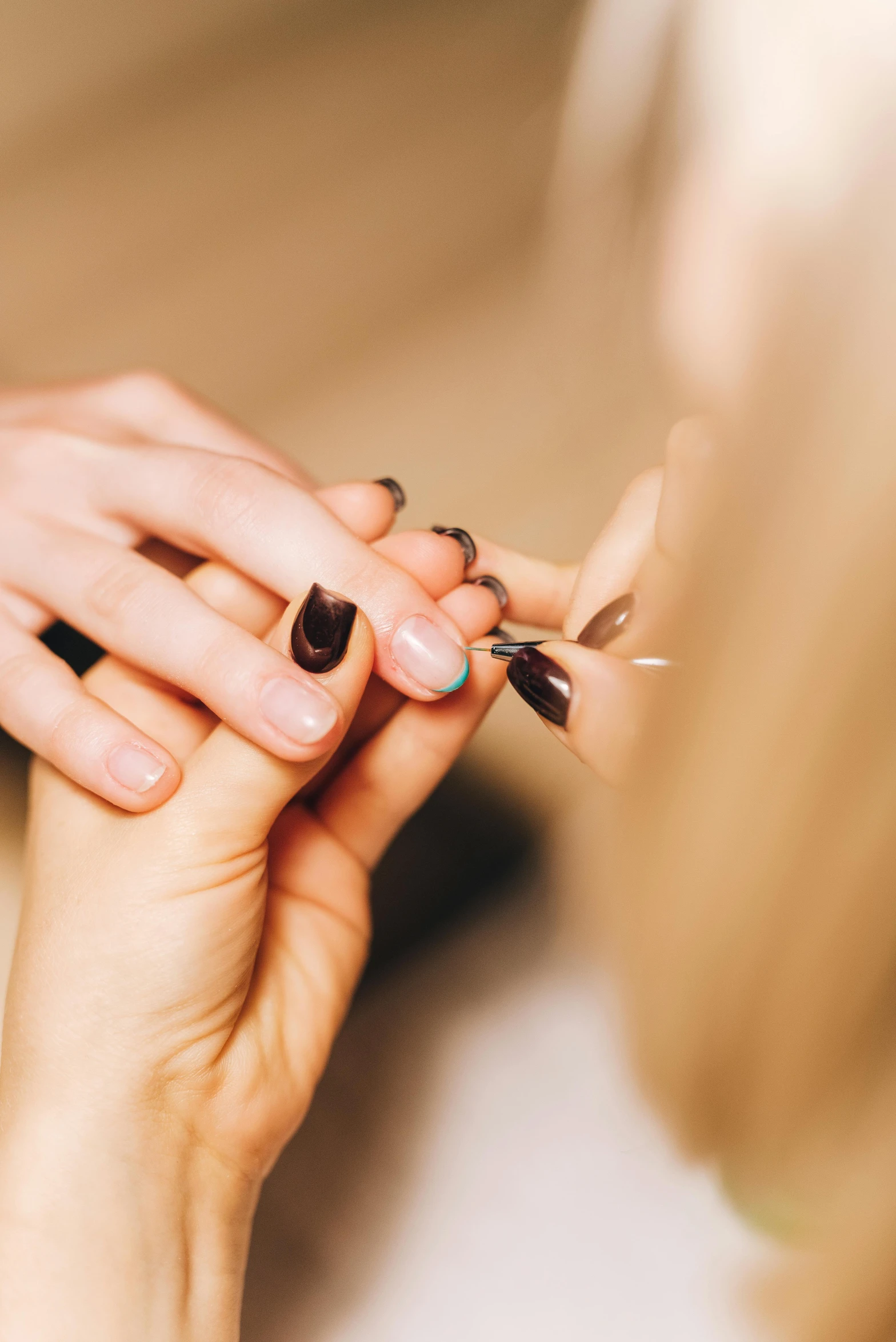 woman holding a ring and trying to wear it