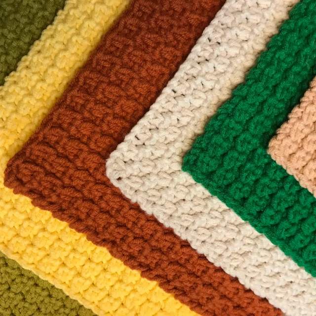 close up view of colored crocheted dishcloth