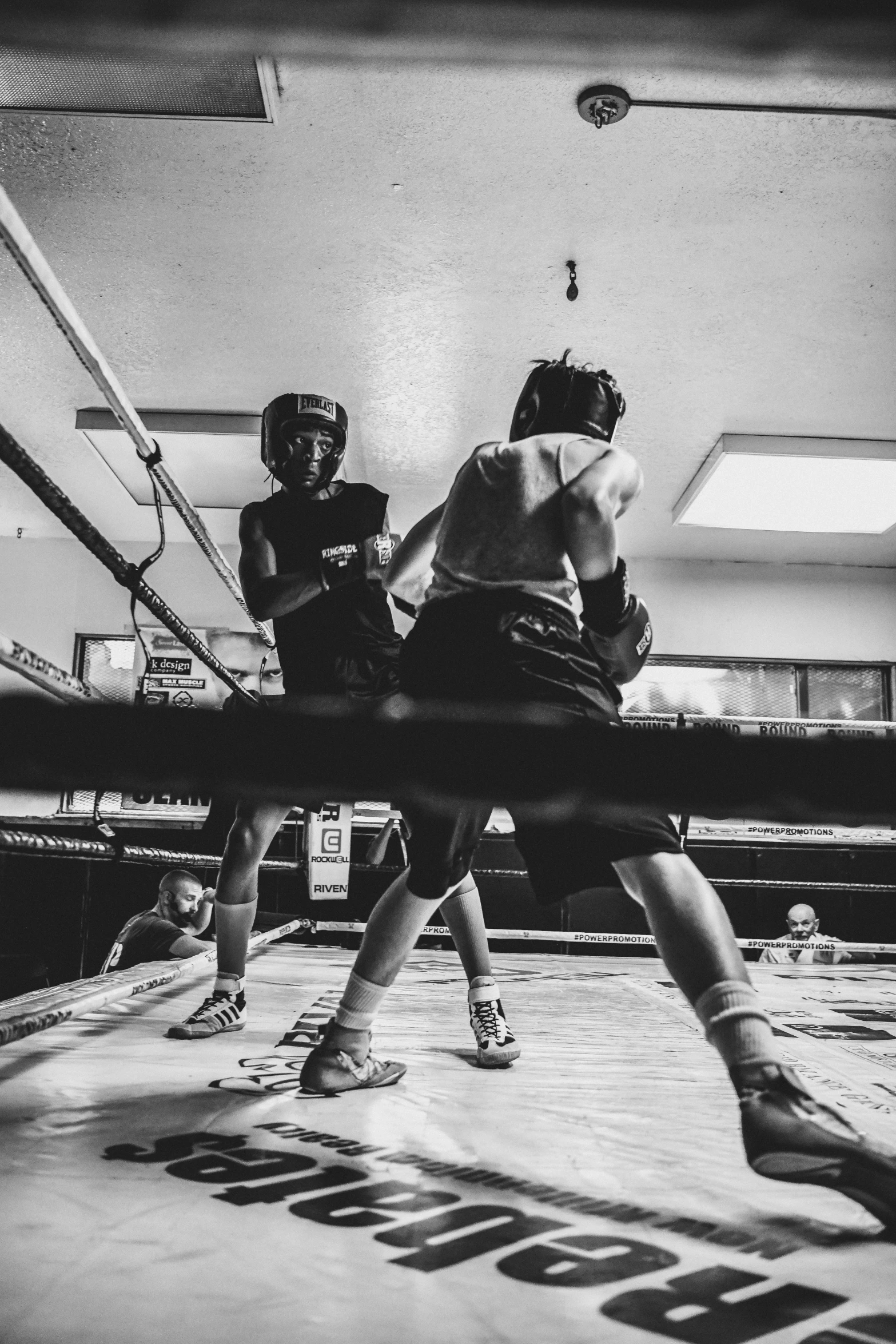 boxers practicing their technique in the ring at the beginning of a match