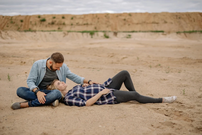 the young couple is on the beach getting ready to share a good time