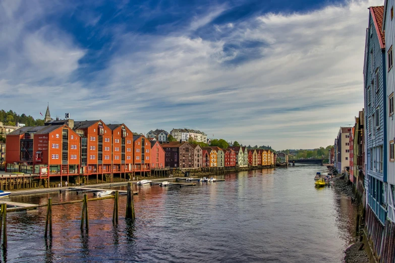 a row of buildings on the side of a river