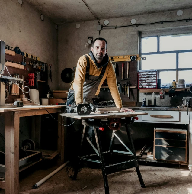 a man working in a woodwork shop