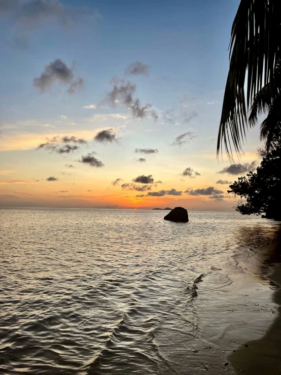 there is a view of a sandy beach at dusk