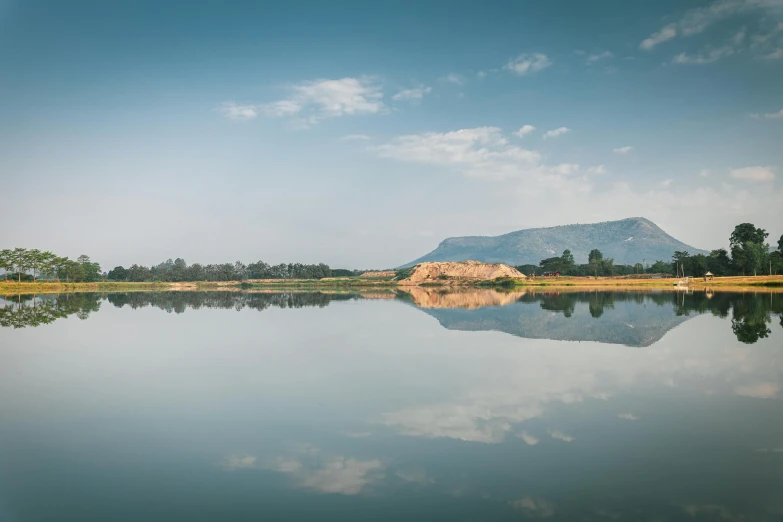 a body of water with hills in the background