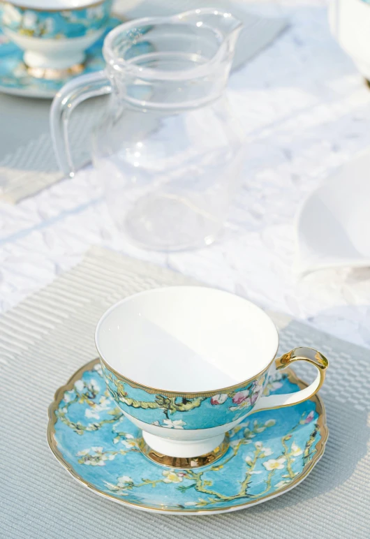 a table topped with blue and white cups