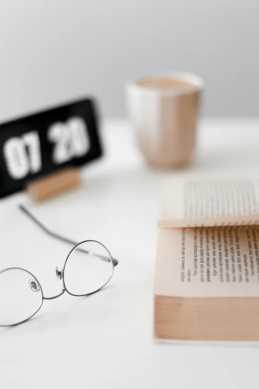 a book with a pair of glasses on top of it