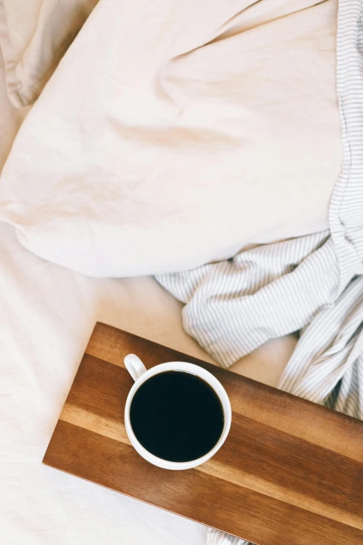 cup of coffee on a wooden  board