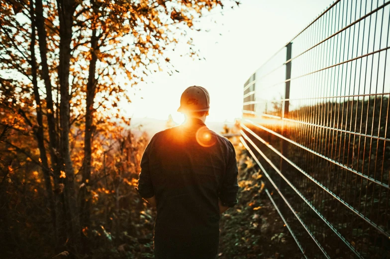 man standing with a view behind him at the sunset