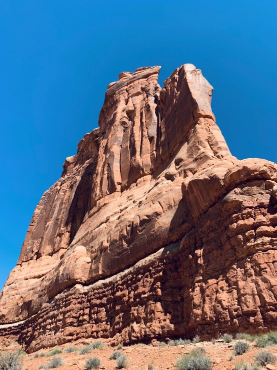 a rocky mountain, with large rocks and sp trees