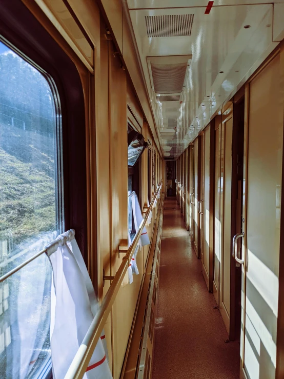 a long train car on a train with a window