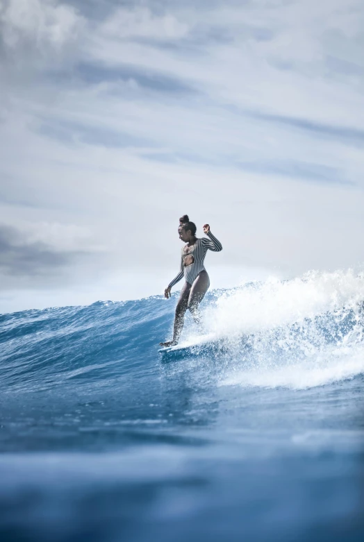 a person on a surfboard riding a wave