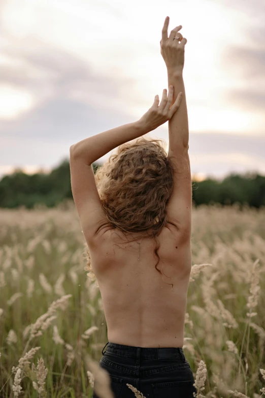 a man with  on standing in a field