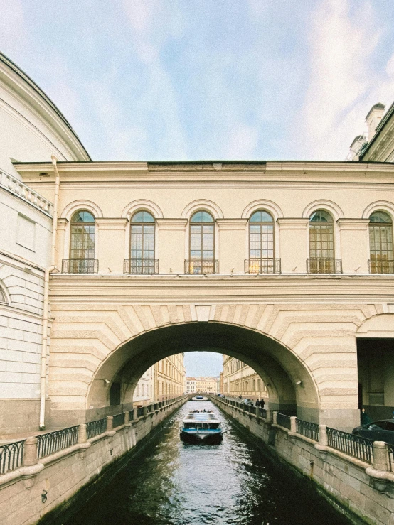 a car is driving under an overpass on the street