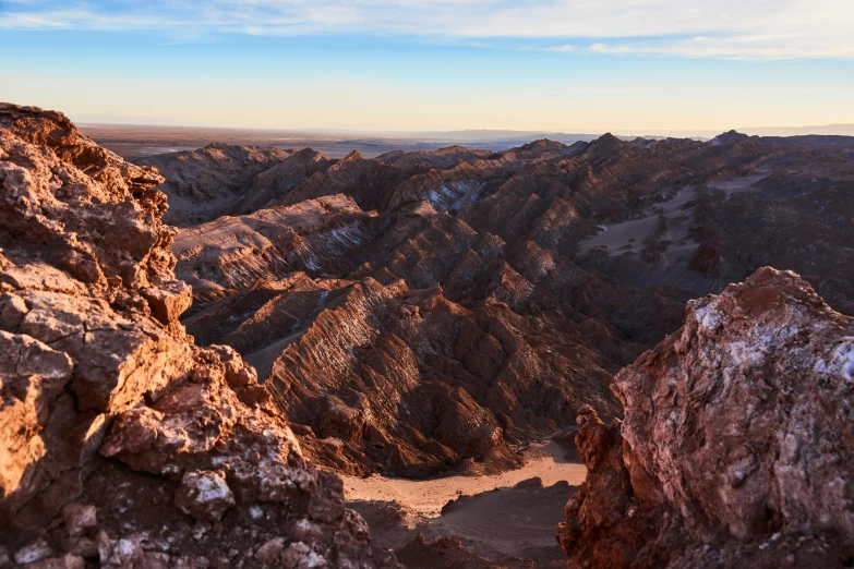 there is a mountain view at sunset from this cliff