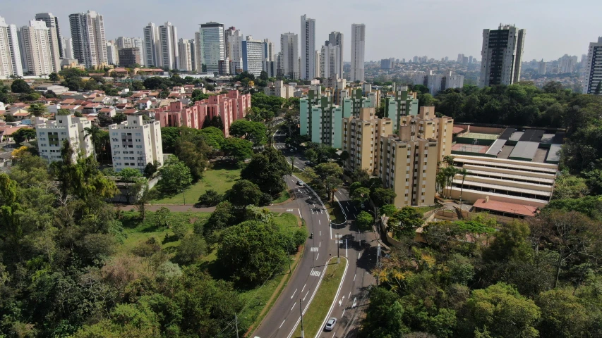 an aerial s of buildings and trees on a city street
