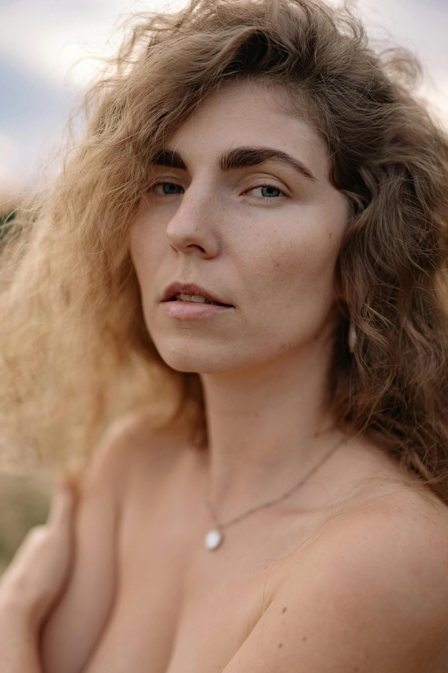 woman with  body and tan frecked skin posing for picture