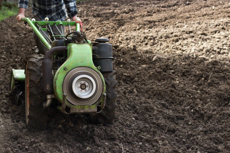 the person in the tractor has it's wheels out